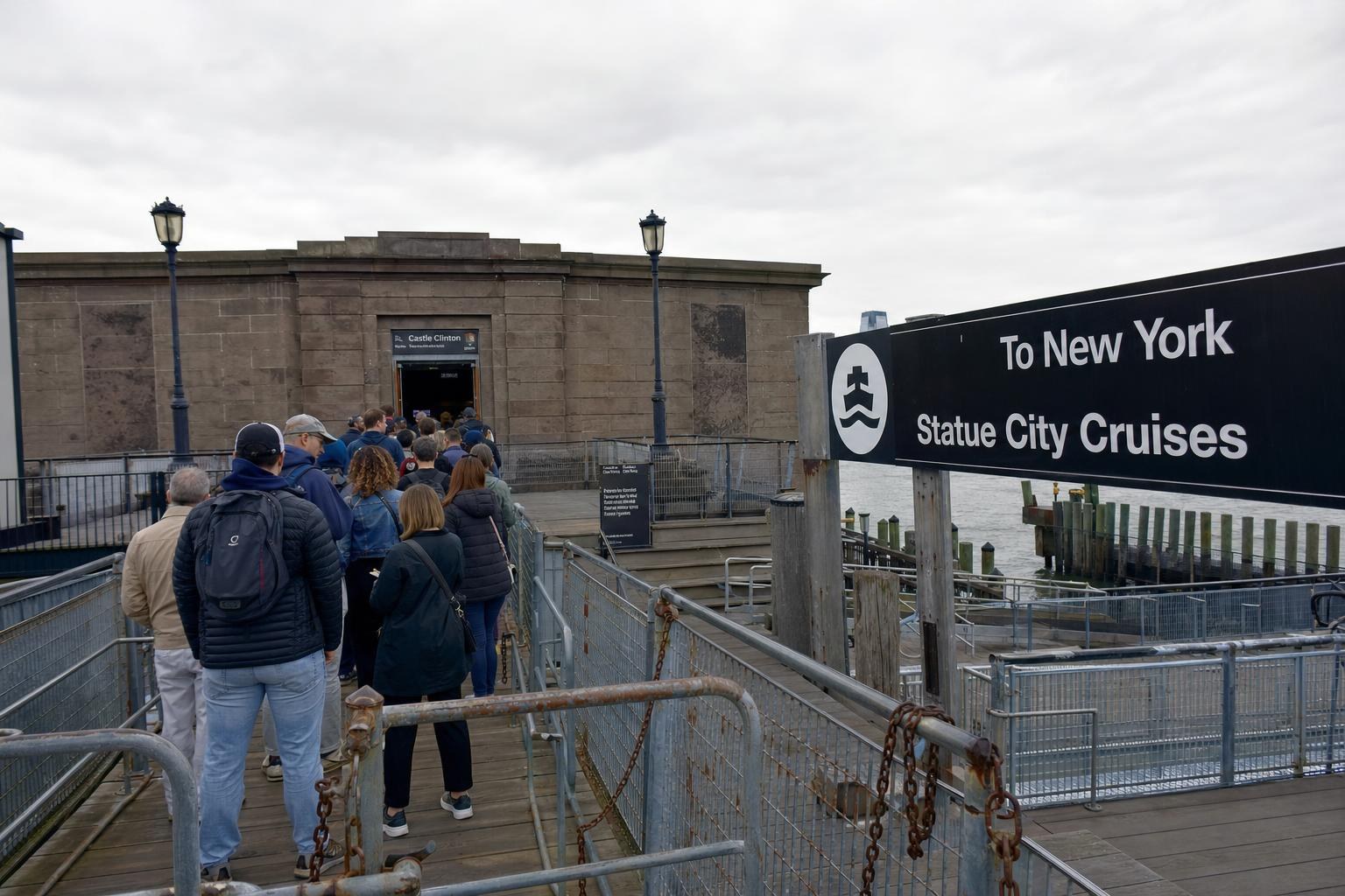 AI-generated illustration: Ferry boarding at Castle Clinton, Battery Park, New York City, with passengers preparing for Statue of Liberty trip