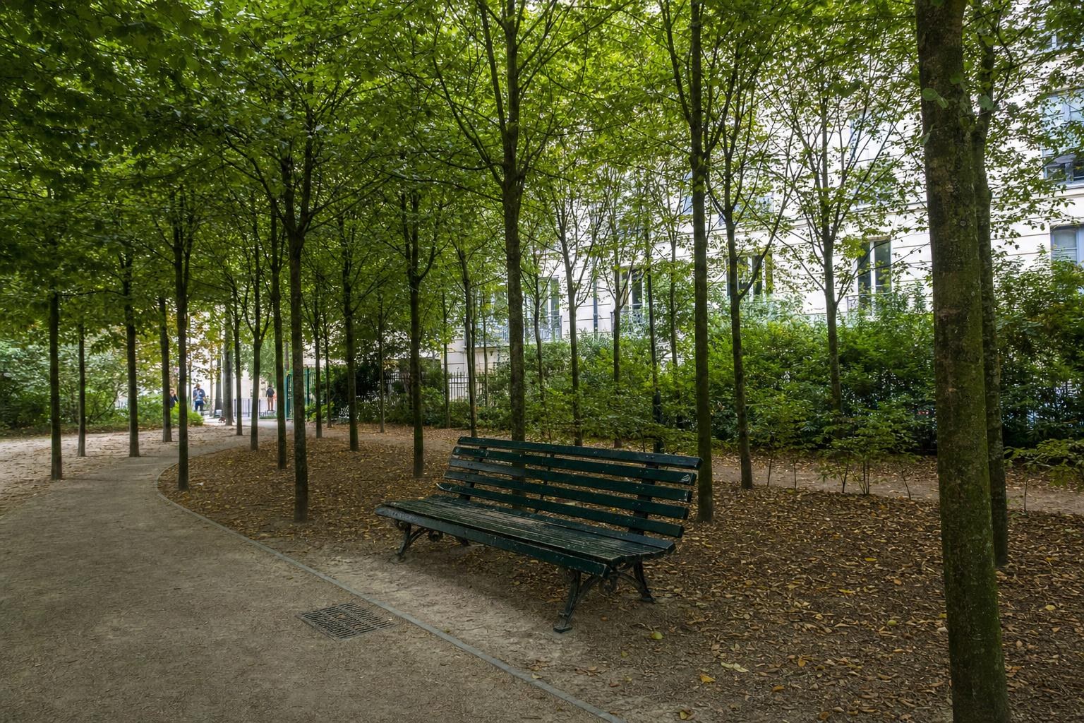 AI-generated illustration: A peaceful green garden in the 18th arrondissement of Paris with a solitary park bench beneath young trees
