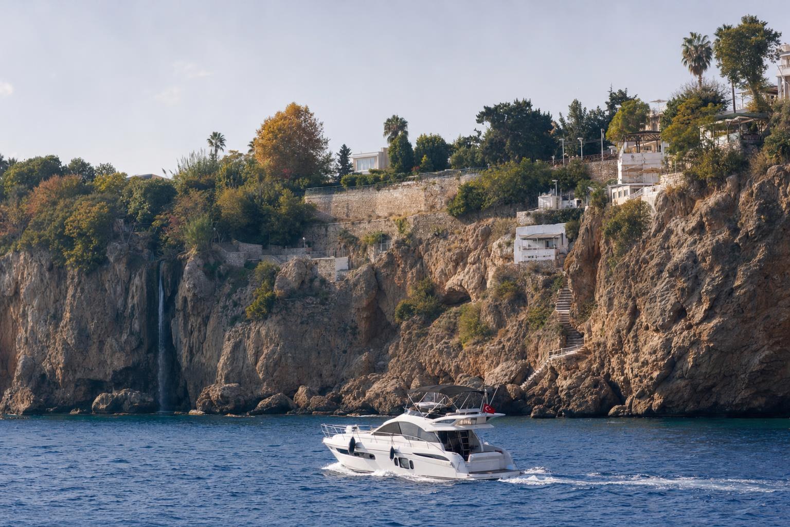 AI-generated illustration: A small yacht passing Antalya's sea cliffs under soft autumn sunlight