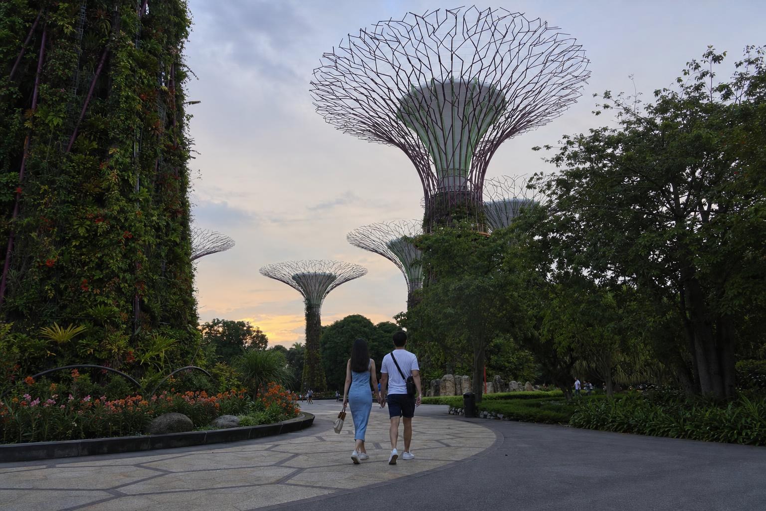 AI-generated illustration: A couple taking a sunset walk amid Supertree Grove at Gardens by the Bay, Singapore