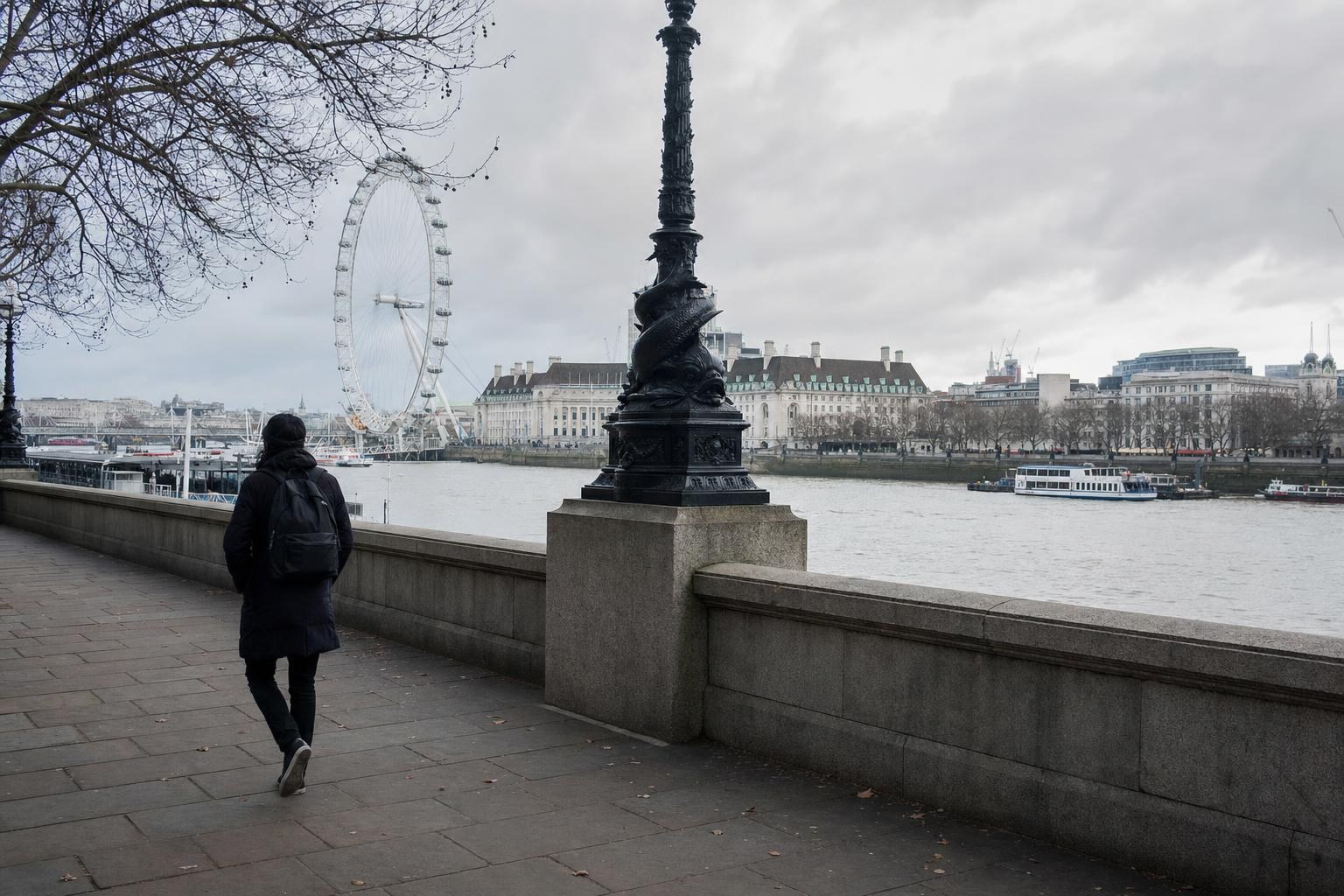 AI-generated illustration: A single pedestrian walking riverside near the London Eye on the South Bank, with the Thames and city skyline in the background, London, United Kingdom
